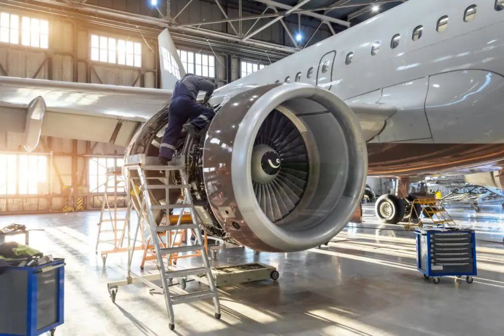 Engineers maintaining an aircraft engine